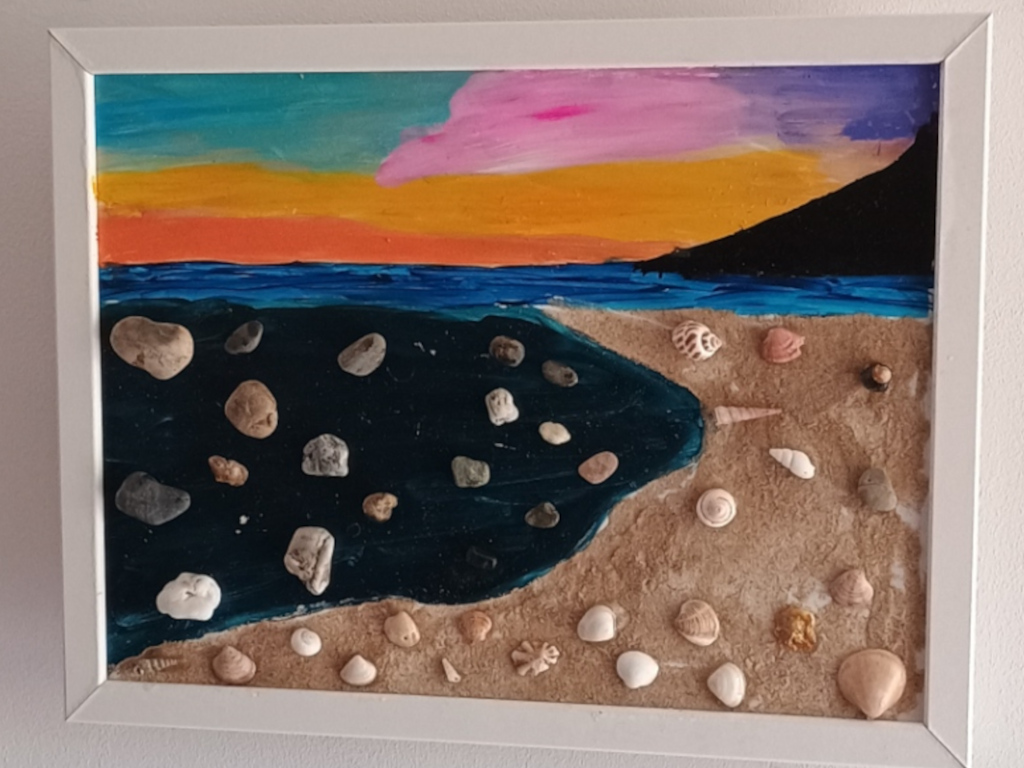 Handmade artwork featuring real sand, shells, and pebbles from Bolonia Beach by Sun Kissed Crafts.